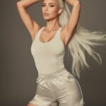 Kim Kardashian Promotes “Beats x Kim” Wireless Airbuds in a Sexy Shoot (9 Photos)