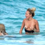 Lana Scolaro Shows Her Nude Tits on the Beach (12 Photos)