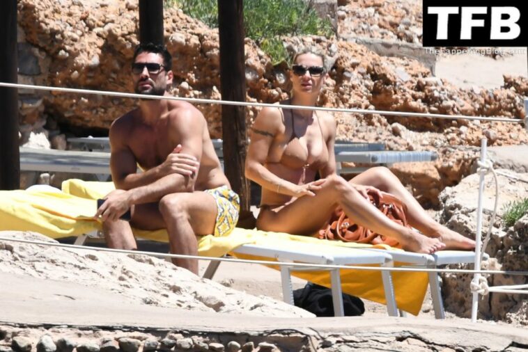 Michelle Hunziker & Giovanni Angiolini Relax on the Beach of Their Hotel in Sardinia (16 Photos)