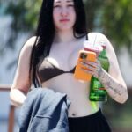 Noah Cyrus Slips Into a Bikini Top Cooling Off From the Sweltering Heat with Her Boyfriend in LA (17 Photos)