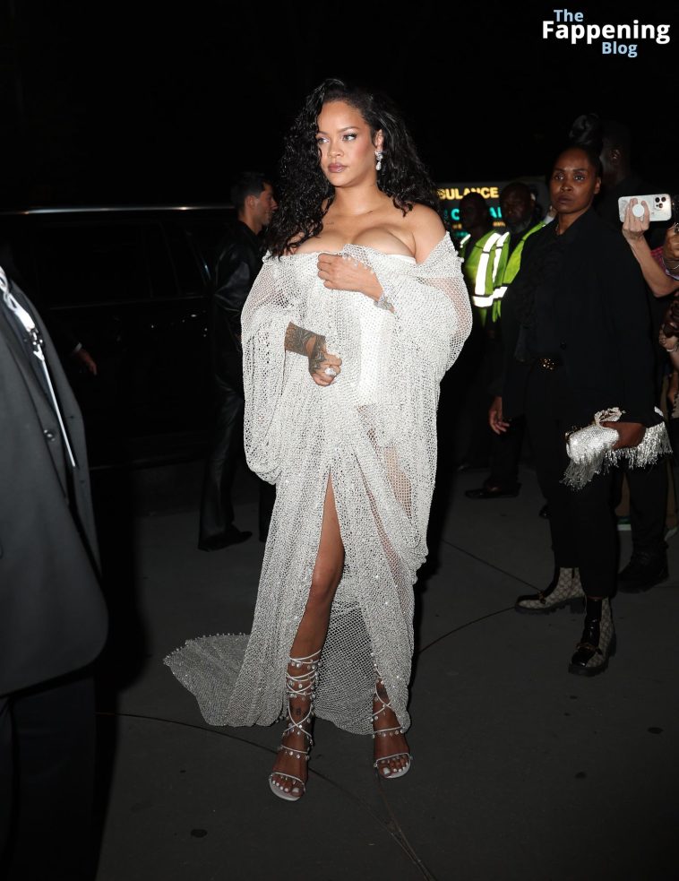 Rihanna Displays Her Curves in a White Dress (13 Photos)