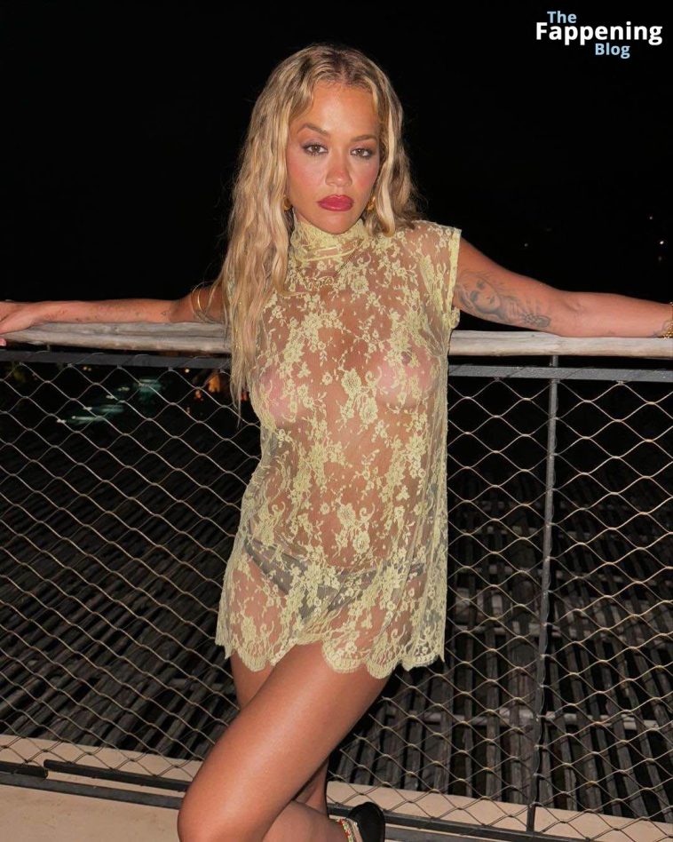 Rita Ora Shows Off Her Nude Boobs While Posing in a Sheer Dress (2 Photos)